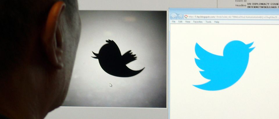 A man looks at a computer monitor showing the and old (L) and new (R) Twitter logos, June 6, 2012 in Washington DC. Twitter unveiled the new "Twitterbird" on June 6, 2012 as the new trademark symbol for the fast-growing company. (Photo by Douglas E. Curran/AFP via Getty Images)