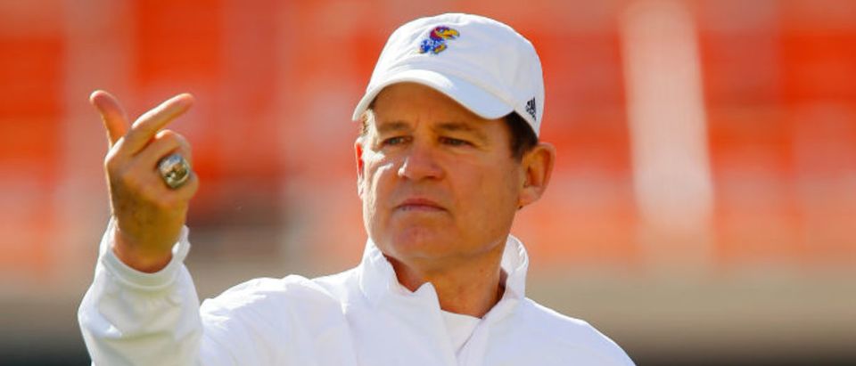 STILLWATER, OK - NOVEMBER 16: Head Coach Les Miles of the Kansas Jayhawks watches his team warm up before a game against the Oklahoma State Cowboys on November 16, 2019 at Boone Pickens Stadium in Stillwater, Oklahoma. (Photo by Brian Bahr/Getty Images)
