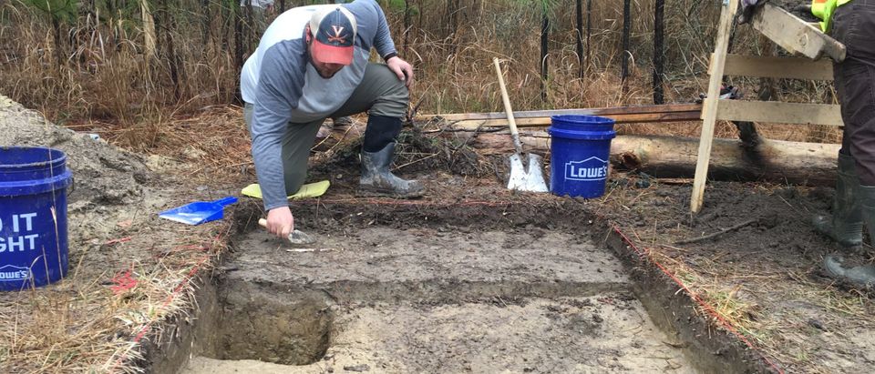 Archaeologist Brandon Ellis searches for artifacts at the Ben Ross Homestead [Photo credit: Maryland Department of Transportation]
