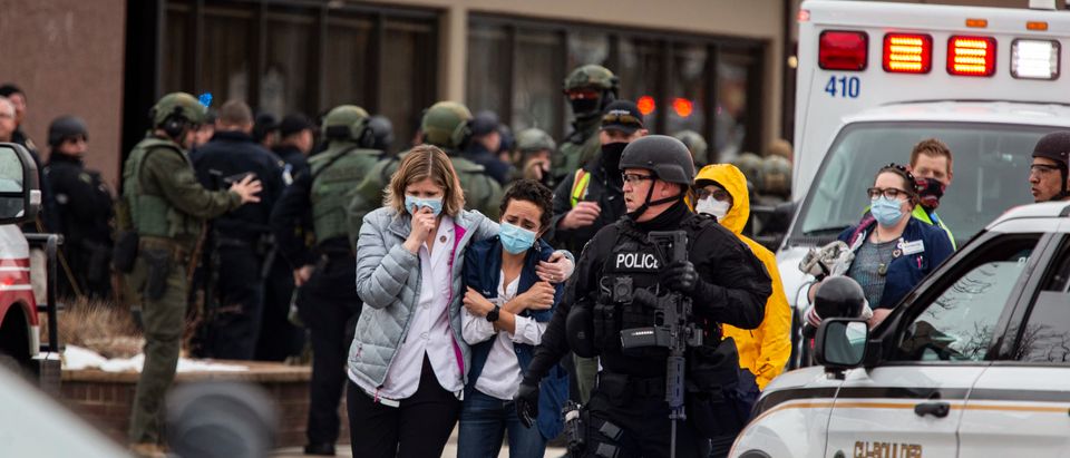 Healthcare workers walk out of a King Sooper's Grocery store after a gunman opened fire on March 22, 2021 in Boulder, Colorado. (Chet Strange/Getty Images)