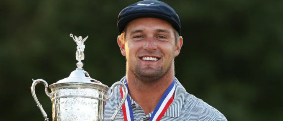 MAMARONECK, NEW YORK - SEPTEMBER 20: Bryson DeChambeau of the United States celebrates with the championship trophy after winning the 120th U.S. Open Championship on September 20, 2020 at Winged Foot Golf Club in Mamaroneck, New York. (Photo by Gregory Shamus/Getty Images)