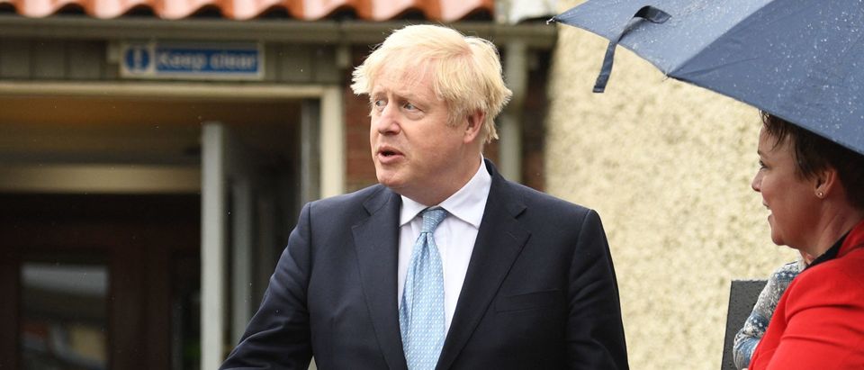 Britain's Prime Minister Boris Johnson reacts as he leaves Jacksons Wharf pub in Hartlepool, northeast England on May 7, 2021 during a visit following the Conservative Party by-election victory in the constituency. (Photo by OLI SCARFF/AFP via Getty Images)