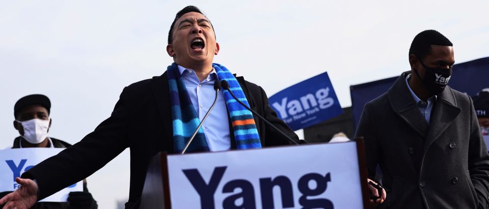 New York City Mayoral candidate Andrew Yang screams as he prepares to speak at a press conference