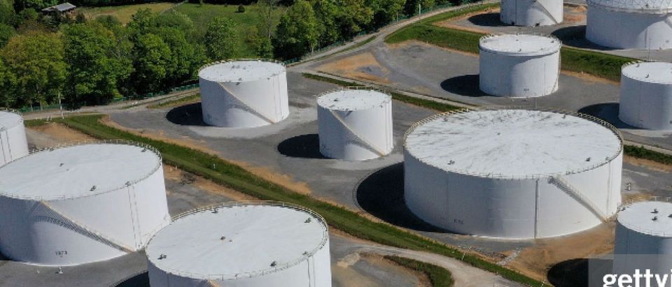 WOODBINE, MD - MAY 13: In an aerial view, fuel holding tanks are seen at Colonial Pipeline's Dorsey Junction Station on May 13, 2021 in Washington, DC. The Colonial Pipeline has returned to operations following a cyberattack that disrupted gas supply for the eastern U.S. for days. (Photo by Drew Angerer/Getty Images)