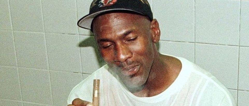 Michael Jordan of the Chicago Bulls enjoys a cigar