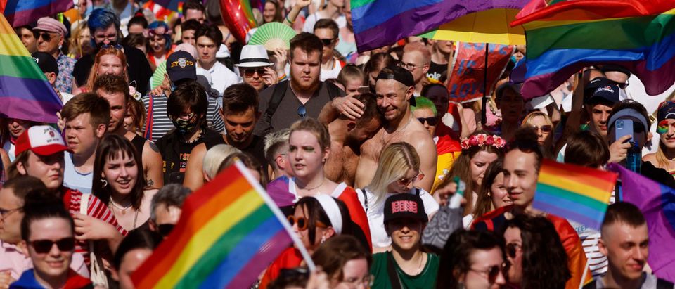 Participants march during the Warsaw Gay Pride parade in central Warsaw on June 19, 2021. (Photo by WOJTEK RADWANSKI/AFP via Getty Images)