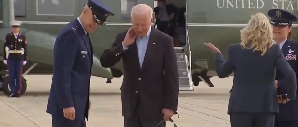 Bug flies on Biden’s neck outside Air Force One in Maryland on June,9,2021. [Youtube:Screenshot:Bloomberg Quicktake: Now]