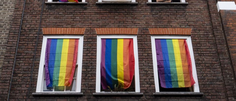 Rainbow flags cover a set of windows in Soho as Members of the Lesbian, Gay, Bisexual and Transgender (LGBT) community hold the annual Pride Parade in London on July 6, 2019. (Photo by Niklas Halle'n/AFP via Getty Images)