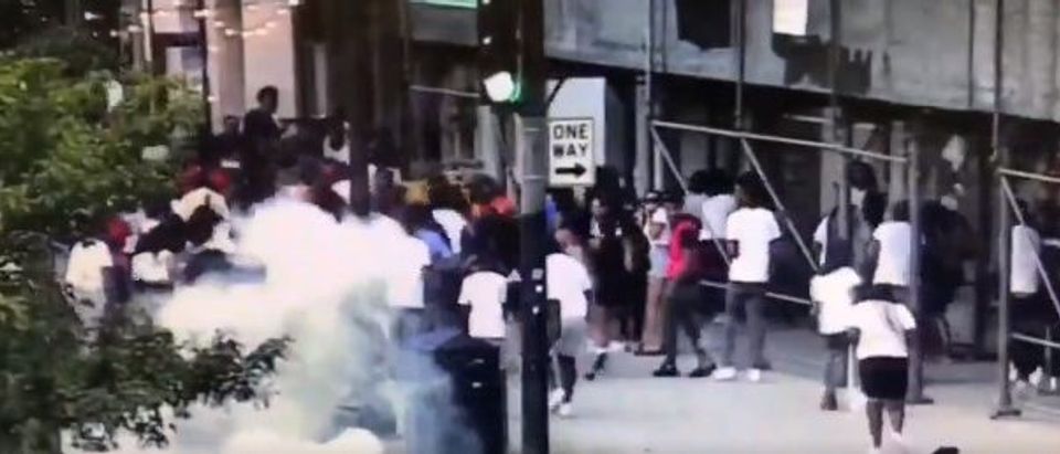 Large crowds throw fireworks at police officers in Chicago Sunday night[Twitter/Screenshot/16th and 17th District Chicago Police Scanner]