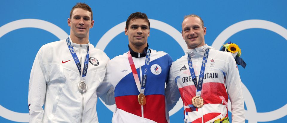 Silver medalist Ryan Murphy of Team United States, gold medalist Evgeny Rylov of Team ROC and bronze medalist Luke Greenbank of Team Great Britain pose on the podium during the medal ceremony for the Men's 200m Backstroke Final on day seven of the Tokyo 2020 Olympic Games at Tokyo Aquatics Centre on July 30, 2021 in Tokyo, Japan. (Photo by Maddie Meyer/Getty Images)