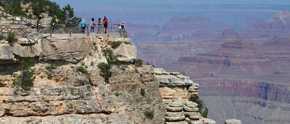 Tourists enjoy the breathtaking view of the Grand Canyon from the South Rim side on August 24, 2020 amid the coronavirus pandemic. (Photo by DANIEL SLIM/AFP via Getty Images)