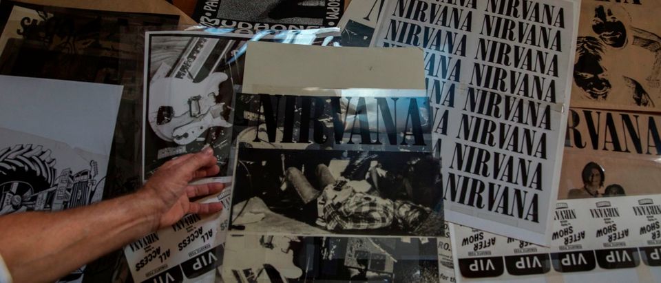 US artist Jeff Ross shows off his print posters he made for Nirvana, in Pancevo, near Belgrade on August 6, 2019. - He was the first to design posters and tee-shirts for the Nirvana band. (Photo by Vladimir Zivojinovic / AFP) / RESTRICTED TO EDITORIAL USE - MANDATORY MENTION OF THE ARTIST UPON PUBLICATION - TO ILLUSTRATE THE EVENT AS SPECIFIED IN THE CAPTION (Photo credit should read VLADIMIR ZIVOJINOVIC/AFP via Getty Images)