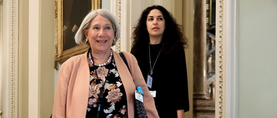 WASHINGTON, DC - JULY 22: Anita Dunn(L), senior advisor to President Joe Biden, and White House Deputy Director of Legislative Affairs Reema Dodin arrive for a lunch meeting with Senate Democrats at the U.S. Capitol on July 22, 2021 in Washington, DC. Dunn and Dodin are meeting with the senators to to help them push back against Republican accusations that the president's Build Back Better agenda is reckless spending. She suggested Democrats highlight the budget's 'child tax credits, lower prescription drug costs, universal pre-school' and as a tax cut for middle class families. (Photo by Chip Somodevilla/Getty Images)