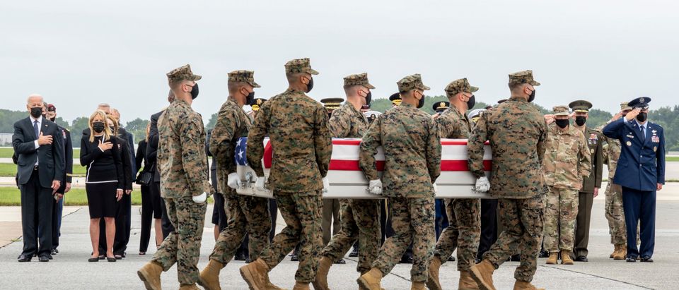 In this handout photo provided by the U.S. Air Force, a U.S. Marine Corps carry team transfers the remains of Marine Corps Cpl. Daegan W. Page of Omaha, Nebraska, Aug. 29, 2021 at Dover Air Force Base, Delaware. Page was assigned to 2nd Battalion, 1st Marine Regiment, 1st Marine Division, I Marine Expeditionary Force, Camp Pendleton, California. (Photo by Jason Minto/U.S. Air Force via Getty Images)