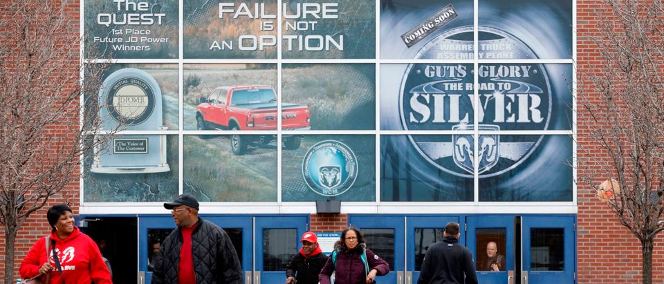Workers leave FCA Chrysler Warren Truck Assembly after the Detroit three automakers have agreed to UAW demands to shut down all North America plants as a precaution against coronavirus, on March 18, 2020 in Detroit, Michigan. (Photo by JEFF KOWALSKY/AFP via Getty Images)