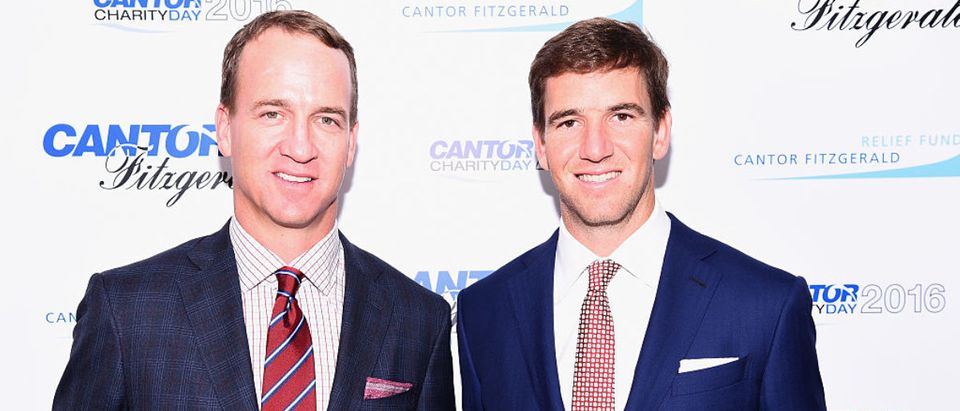 NEW YORK, NY - SEPTEMBER 12: Former NFL player Peyton Manning and NY Giants, NFL player Eli Manning attend the Annual Charity Day hosted by Cantor Fitzgerald, BGC and GFI at Cantor Fitzgerald on September 12, 2016 in New York City. (Photo by Dave Kotinsky/Getty Images for Cantor Fitzgerald)