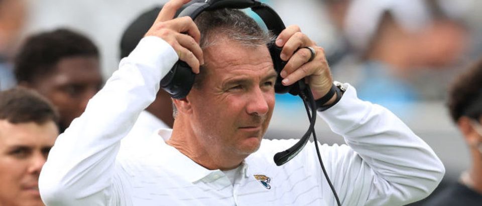JACKSONVILLE, FLORIDA - SEPTEMBER 19: Head coach Urban Meyer of the Jacksonville Jaguars puts on a headset during the fourth quarter against the Denver Broncos at TIAA Bank Field on September 19, 2021 in Jacksonville, Florida. (Photo by Sam Greenwood/Getty Images)