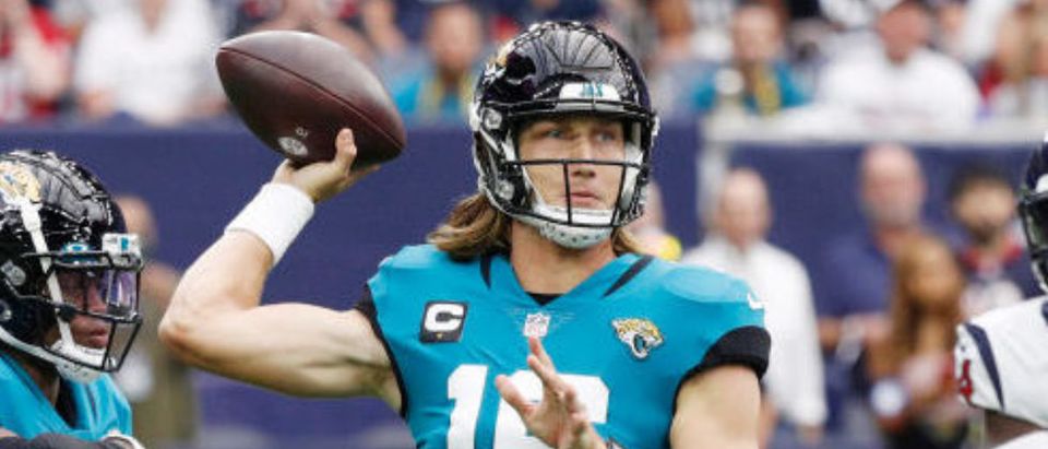 HOUSTON, TEXAS - SEPTEMBER 12: Trevor Lawrence #16 of the Jacksonville Jaguars throws a pass against the Houston Texans during the first quarter at NRG Stadium on September 12, 2021 in Houston, Texas. (Photo by Bob Levey/Getty Images)