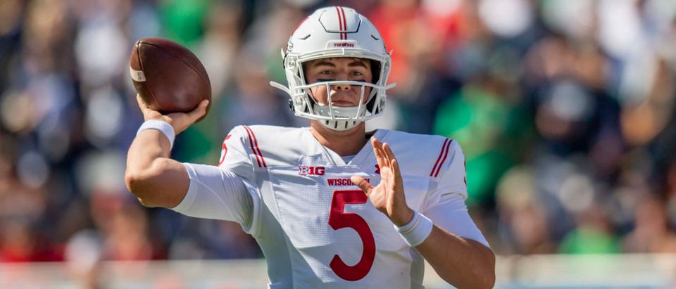 Sep 25, 2021; Chicago, Illinois, USA; Wisconsin Badgers quarterback Graham Mertz (5) passes during the first half against the Notre Dame Fighting Irish at Soldier Field. Mandatory Credit: Patrick Gorski-USA TODAY Sports via Reuters