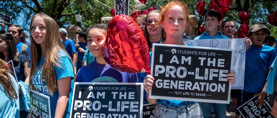 Pro-life protesters stand near the gate of the Texas state capitol at a protest outside the Texas state capitol on May 29, 2021 in Austin, Texas. (Photo by Sergio Flores/Getty Images)