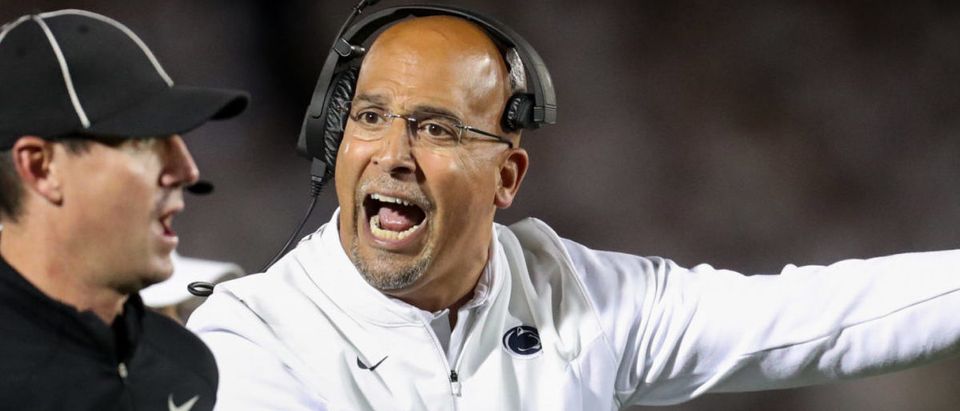 Oct 2, 2021; University Park, Pennsylvania, USA; Penn State Nittany Lions head coach James Franklin (right) reacts towards a sideline official during the first quarter against the Indiana Hoosiers at Beaver Stadium. Mandatory Credit: Matthew OHaren-USA TODAY Sports via Reuters