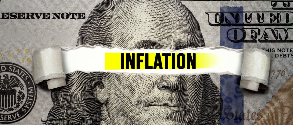 Torn bill reveals inflation sign [Shutterstock/Cinemato]