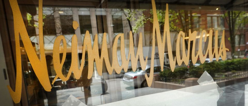 A closed sign hangs in the window of a Neiman Marcus store that has been shuttered by the COVID-19 pandemic on May 07, 2020 in Chicago, Illinois. Neiman Marcus filed for bankruptcy today, making it the first major retailer to seek bankruptcy protection since the economic collapse brought on by the coronavirus pandemic. I (Photo by Scott Olson/Getty Images)