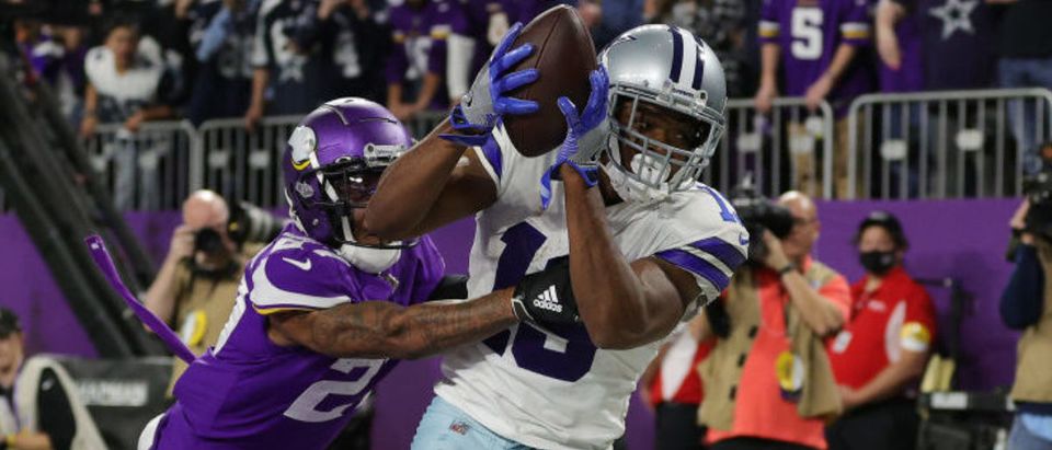 MINNEAPOLIS, MINNESOTA - OCTOBER 31: Amari Cooper #19 of the Dallas Cowboys catches a five-yard touchdown pass from Cooper Rush #10 (not pictured) against Cameron Dantzler #27 of the Minnesota Vikings during the fourth quarter at U.S. Bank Stadium on October 31, 2021 in Minneapolis, Minnesota. (Photo by Stacy Revere/Getty Images)
