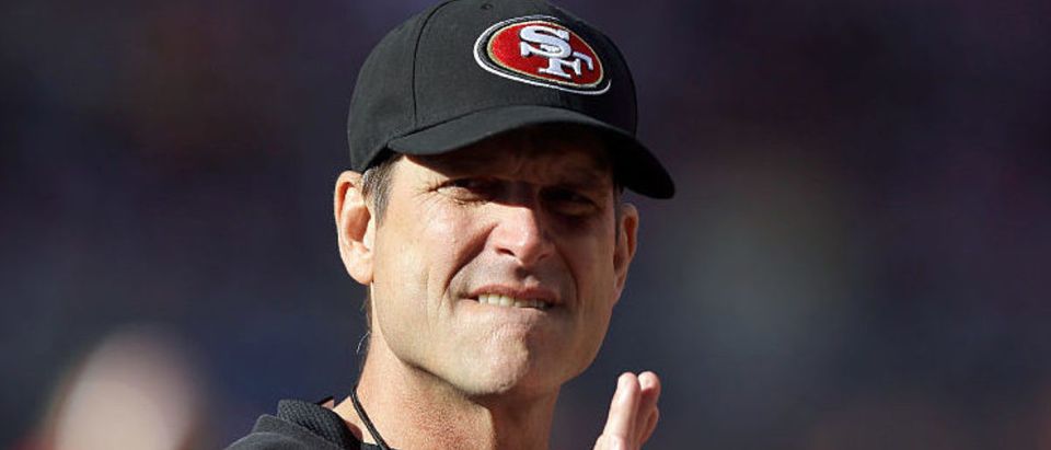 SANTA CLARA, CA - DECEMBER 28: Head coach Jim Harbaugh of the San Francisco 49ers stands on the field before their game against the Arizona Cardinals at Levi's Stadium on December 28, 2014 in Santa Clara, California. (Photo by Ezra Shaw/Getty Images)