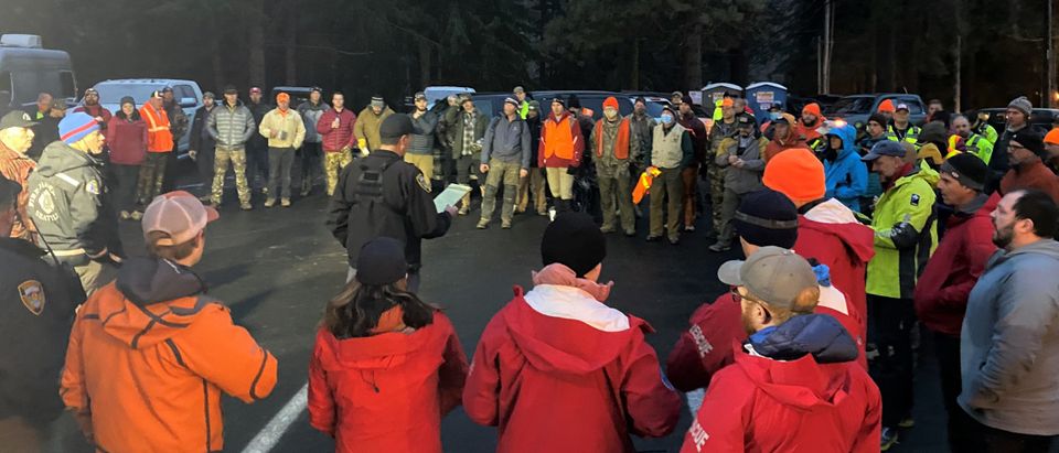 Search and rescue volunteers are briefed on search plans days after Deputy Fire Chief reported missing.