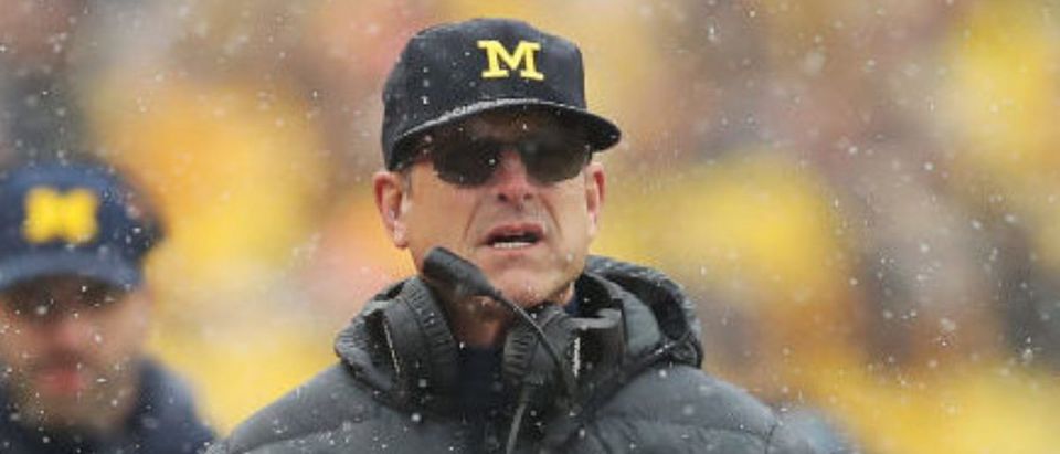 ANN ARBOR, MICHIGAN - NOVEMBER 27: Head coach Jim Harbaugh of the Michigan Wolverines looks on during the first quarter against the Ohio State Buckeyes at Michigan Stadium on November 27, 2021 in Ann Arbor, Michigan. (Photo by Mike Mulholland/Getty Images)