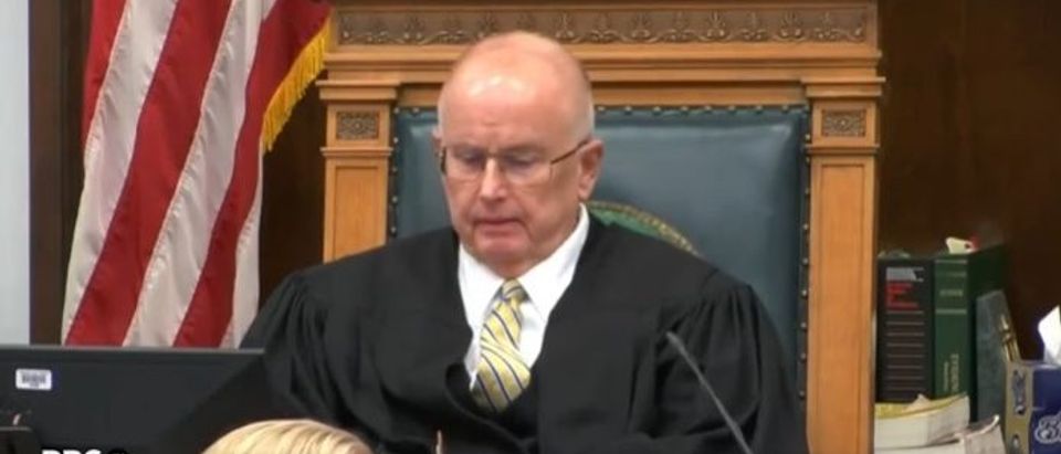 Judge Bruce Schroeder checks phone [Twitter Screenshot David Carlson]