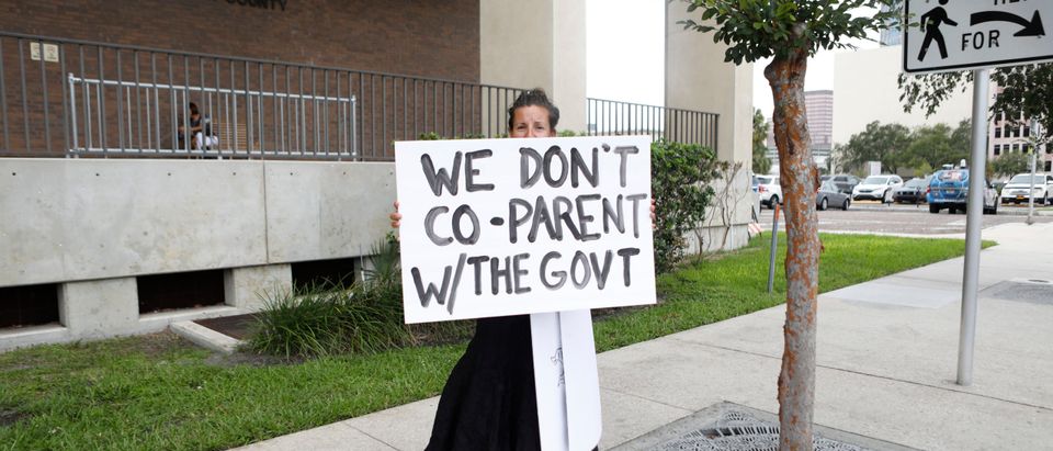 Families protest any potential mask mandates before the Hillsborough County Schools Board meeting held at the district office on July 27, 2021 in Tampa, Florida. The Centers for Disease Control and Prevention recommended those who are vaccinated should wear masks indoors including students returning to school. (Photo by Octavio Jones/Getty Images)