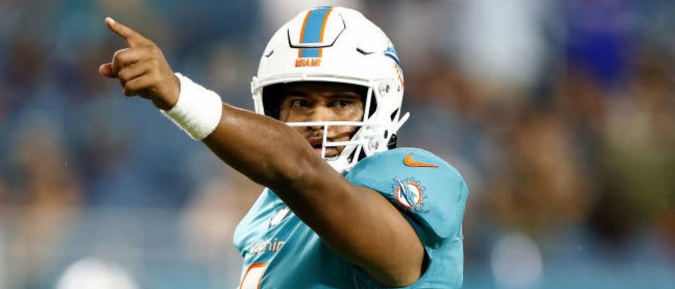 MIAMI GARDENS, FLORIDA - NOVEMBER 11: Tua Tagovailoa #1 of the Miami Dolphins signals a first down against the Baltimore Ravens during the fourth quarter in the game at Hard Rock Stadium on November 11, 2021 in Miami Gardens, Florida. (Photo by Michael Reaves/Getty Images)