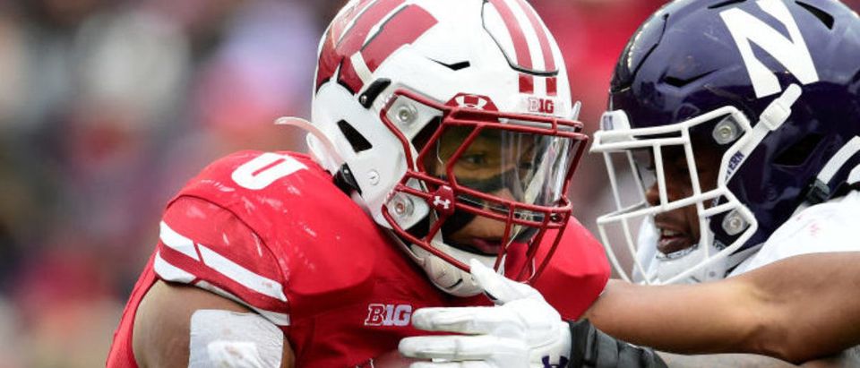 MADISON, WISCONSIN - NOVEMBER 13: Braelon Allen #0 of the Wisconsin Badgers carries the ball in the first half against the Northwestern Wildcats at Camp Randall Stadium on November 13, 2021 in Madison, Wisconsin. (Photo by Patrick McDermott/Getty Images)