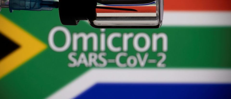 FILE PHOTO: A vial and a syringe are seen in front of a displayed South Africa flag and words "Omicron SARS-CoV-2" in this illustration taken