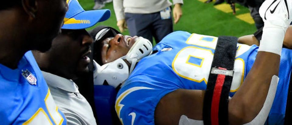 INGLEWOOD, CALIFORNIA - DECEMBER 16: Donald Parham #89 of the Los Angeles Chargers is taken off the field to be assessed further for injury in the first quarter of the game against the Kansas City Chiefs at SoFi Stadium on December 16, 2021 in Inglewood, California. (Photo by Kevork Djansezian/Getty Images)