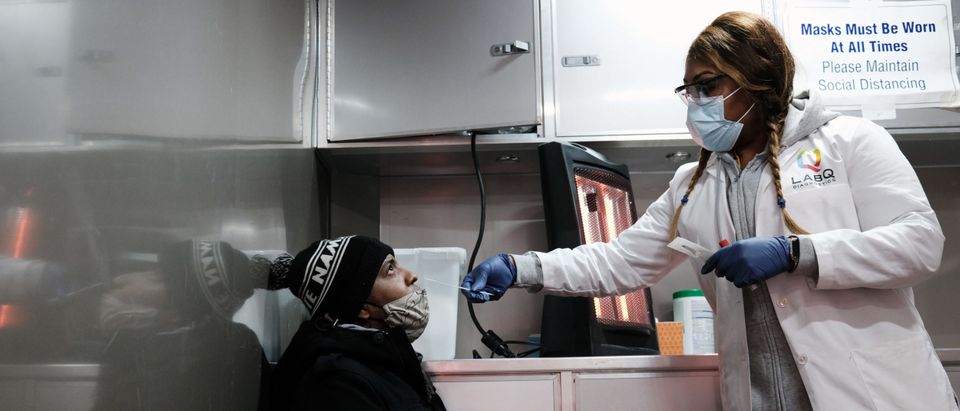 NEW YORK, NEW YORK - JANUARY 27: A man takes a Covid-19 test at a mobile clinic in Brooklyn on January 27, 2021 in New York City. With the overall infection rate across the state on the decline and 72% of healthcare workers now having received the COVID-19 vaccine, Governor Andrew Cuomo has announced that some restrictions in New York may be lifted in the near future. According to the Governor this will not include indoor dining. (Photo by Spencer Platt/Getty Images)