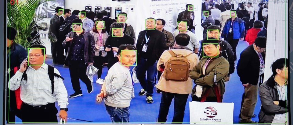 A screen shows visitors being filmed by AI (artificial intelligence) security cameras with facial recognition technology at the 14th China International Exhibition on Public Safety and Security at the China International Exhibition Center in Beijing on October 24, 2018. (Photo by NICOLAS ASFOURI / AFP) (Photo by NICOLAS ASFOURI/AFP via Getty Images)