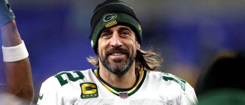 BALTIMORE, MARYLAND - DECEMBER 19: Aaron Rodgers #12 of the Green Bay Packers smiles as he walks off the field after their game against the Baltimore Ravens at M&amp;T Bank Stadium on December 19, 2021 in Baltimore, Maryland. (Photo by Patrick Smith/Getty Images)