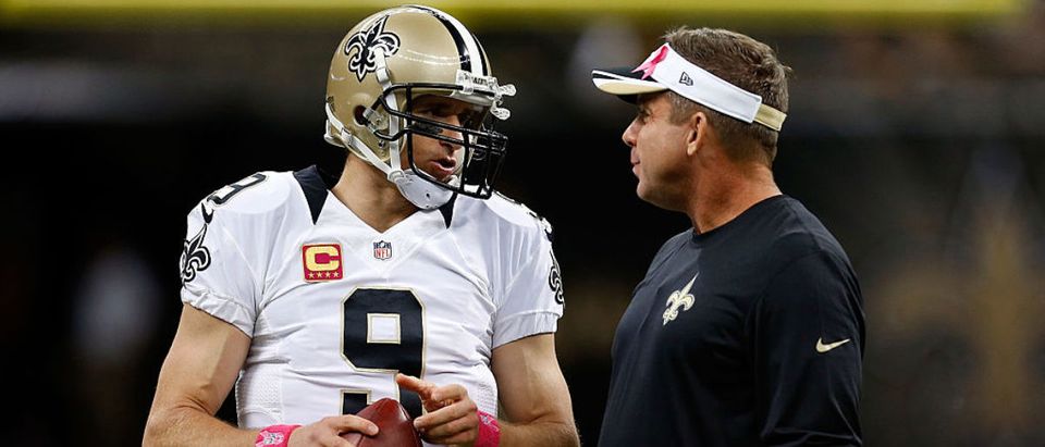 NEW ORLEANS, LA - OCTOBER 05: Head coach Sean Payton of the New Orleans Saints speaks with Drew Brees #9 prior to a game against the Tampa Bay Buccaneers at the Mercedes-Benz Superdome on October 5, 2014 in New Orleans, Louisiana. (Photo by Wesley Hitt/Getty Images)