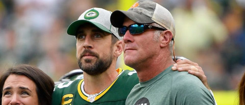 GREEN BAY, WISCONSIN - SEPTEMBER 15: Aaron Rodgers #12 of the Green Bay Packers shares a moment with former quarterback Brett Favre during a ceremony for the late Bart Starr at halftime of the game between the Minnesota Vikings and Green Bay Packers at Lambeau Field on September 15, 2019 in Green Bay, Wisconsin. (Photo by Quinn Harris/Getty Images)