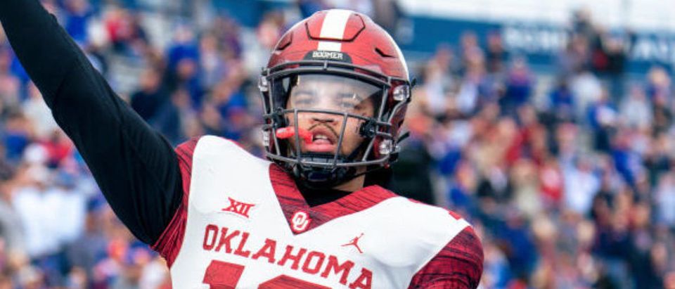 LAWRENCE, KS - OCTOBER 23: Caleb Williams #13 of the Oklahoma Sooners celebrates his touchdown against the Kansas Jayhawks in the fourth quarter at David Booth Kansas Memorial Stadium on October 23, 2021 in Lawrence, Kansas. (Photo by Kyle Rivas/Getty Images)