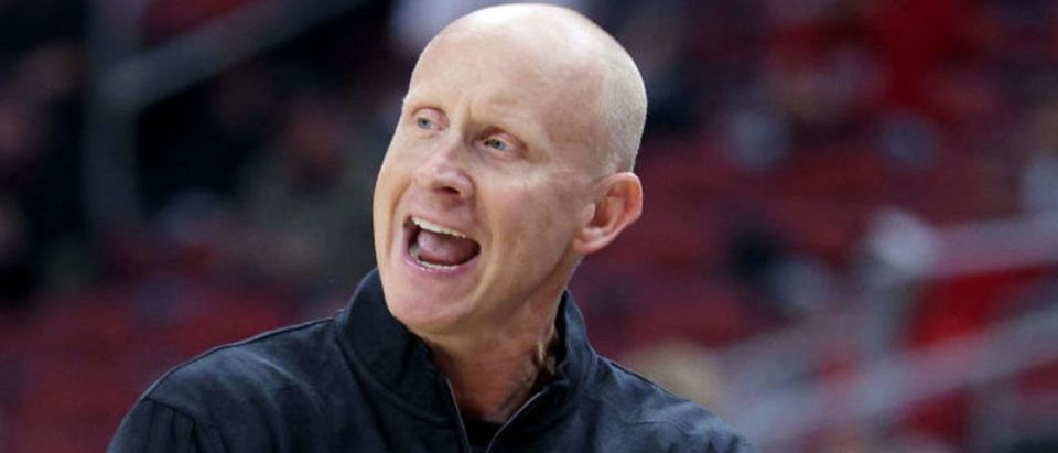 LOUISVILLE, KENTUCKY - DECEMBER 29: Chris Mack the head coach of the Louisville Cardinals during the game against the Wake Forest Deacons at KFC YUM! Center on December 29, 2021 in Louisville, Kentucky. (Photo by Andy Lyons/Getty Images)