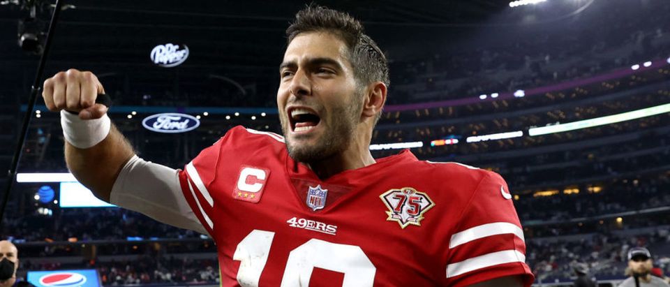 ARLINGTON, TEXAS - JANUARY 16: Jimmy Garoppolo #10 of the San Francisco 49ers walks off the field after defeating the Dallas Cowboys 23-17 in the NFC Wild Card Playoff game at AT&amp;T Stadium on January 16, 2022 in Arlington, Texas. (Photo by Tom Pennington/Getty Images)