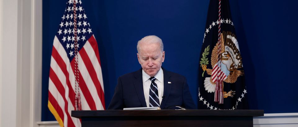 WASHINGTON, DC - JANUARY 13: U.S. President Joe Biden pauses as he starts to give remarks on his administration's response to the surge in COVID-19 cases across the country from the South Court Auditorium in the Eisenhower Executive Office Building on January 13, 2022 in Washington, DC. During the remarks President Biden urged unvaccinated individuals to seek the vaccine and highlighted his plan to distribute free COVID-19 tests and masks to the American people. (Photo by Anna Moneymaker/Getty Images)