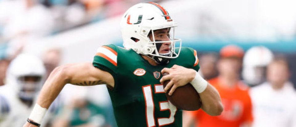 MIAMI GARDENS, FLORIDA - SEPTEMBER 25: Jake Garcia #13 of the Miami Hurricanes runs with the ball against the Central Connecticut State Blue Devils during the first half at Hard Rock Stadium on September 25, 2021 in Miami Gardens, Florida. (Photo by Michael Reaves/Getty Images)