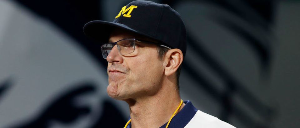2MIAMI GARDENS, FLORIDA - DECEMBER 31: Head Coach Jim Harbaugh of the Michigan Wolverines looks on before the game against the Georgia Bulldogs in the Capital One Orange Bowl for the College Football Playoff semifinal game at Hard Rock Stadium on December 31, 2021 in Miami Gardens, Florida. (Photo by Michael Reaves/Getty Images)