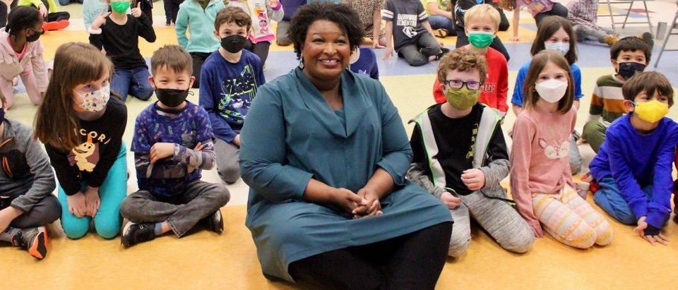Stacey Abrams Campaign Scrambles To Do Damage Control Following Maskless Image With Children