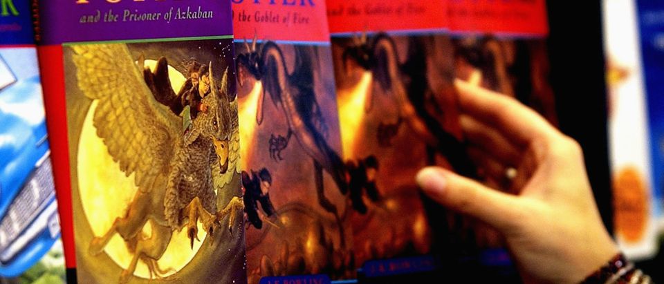 A woman looks at some of J.K Rowlings Harry Potter books in waterstones book store on June 16, 2003 inLondon. (Photo by Graeme Robertson/Getty Images)
